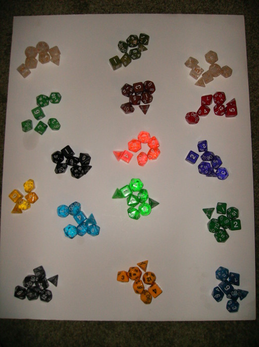 Different sets of dice laid out on floor
